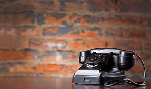 Contact Us - Rotary telephone on a desk